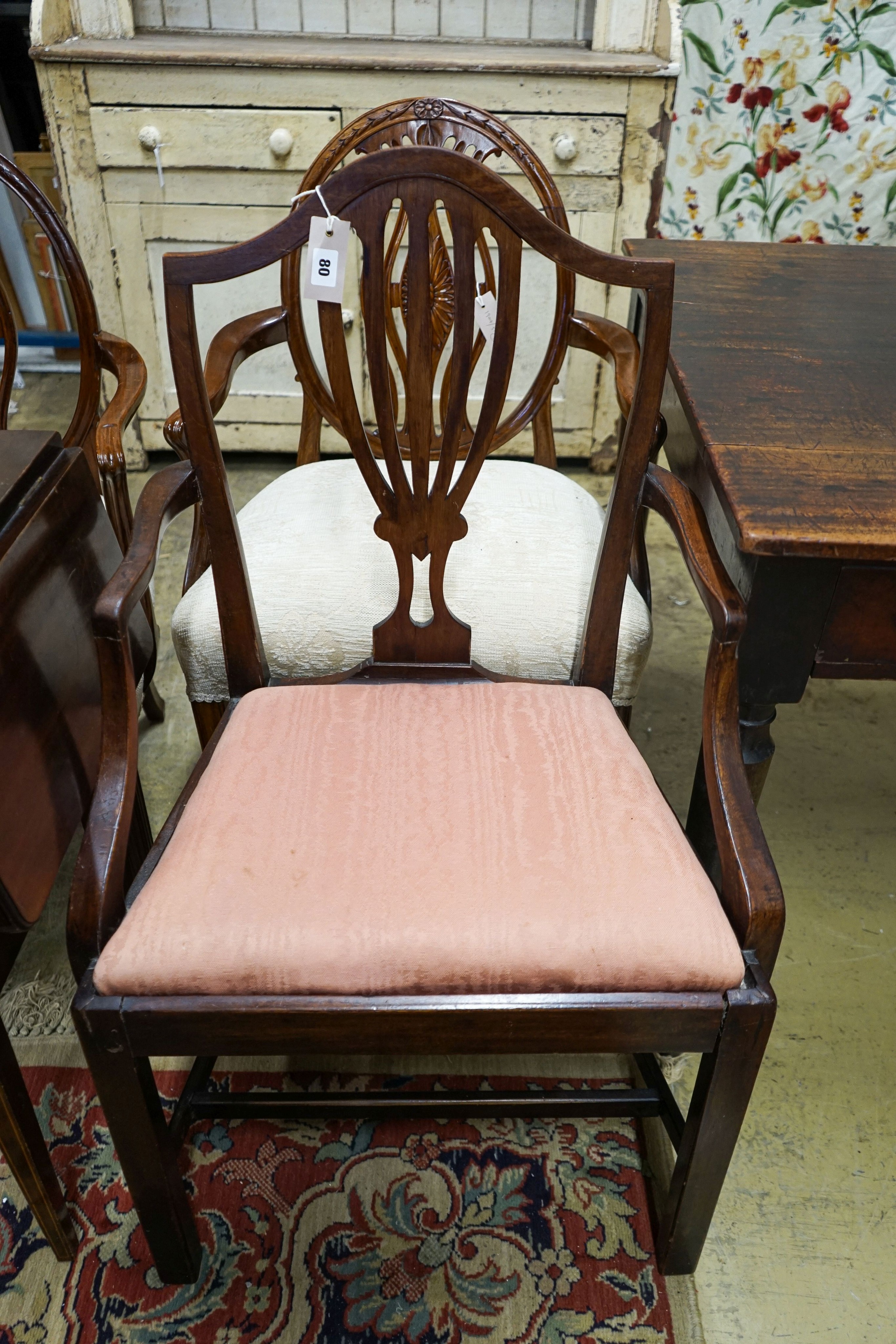 A pair of Hepplewhite style elbow chairs with oval backs, one other chair and a bedside commode cabinet (4)